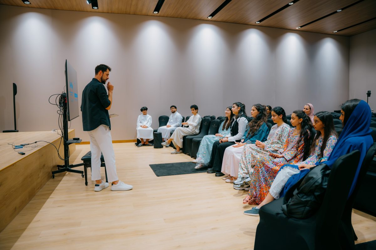 Presenter speaking to participants during a Music District masterclass