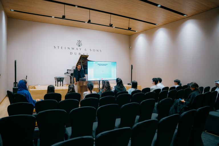Presenter leading a Music District masterclass in a recital room